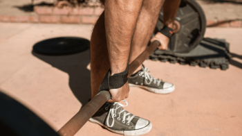 man strength training in converse shoes Choosing The Best Shoes For Strength Training