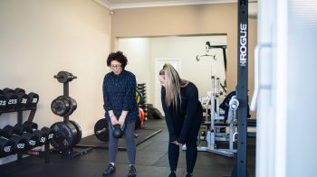 Personal Trainer Rachael Fisher With Client min 5 Reasons Everyone Should Be Strength Training