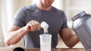 man adding creatine to water Should You Be Taking Creatine?