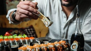 man eating sushi Swap It, Don’t Stop It: 8 Foods With Hidden Calories